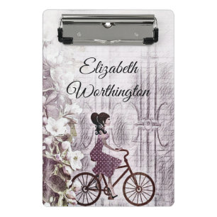 tekening van een jongedame op een fiets mini klembord