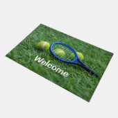 Tennis-racket met bal op groen gras deurmat (Schuin)
