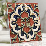 terracotta en marine tegeltje<br><div class="desc">Dit Italiaanse ontwerp toont een opvallende combinatie van terracotta rood, romig wit en marineblauw in elegante vierbladige motieven met ingewikkelde wijndetails. De handgemaakte look en het symmetrische patroon roepen tijdloze mediterrane charme op, perfect voor het verbeteren van backsplashes, accentmuren of decoratieve functies. Met zijn harmonieuze kleurenpalet en prachtige detaillering brengt...</div>