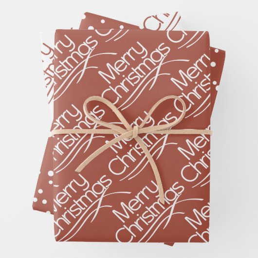 Terracotta, witte kersttypografie en stippen inpakpapier vel (In situ)