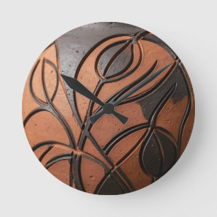Terracotta zwart blad gesneden keramisch patroon ronde klok