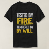 TESTED BY FIRE, TEMPERED BY WILL – Strong Mindset  T-shirt (Design voorkant)
