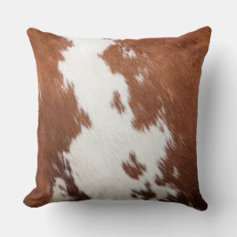 textuur van bruin en wit koeienhuid kussen