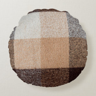 textuur van bruin gevriesdroogde wolvlies. tartan rond kussen