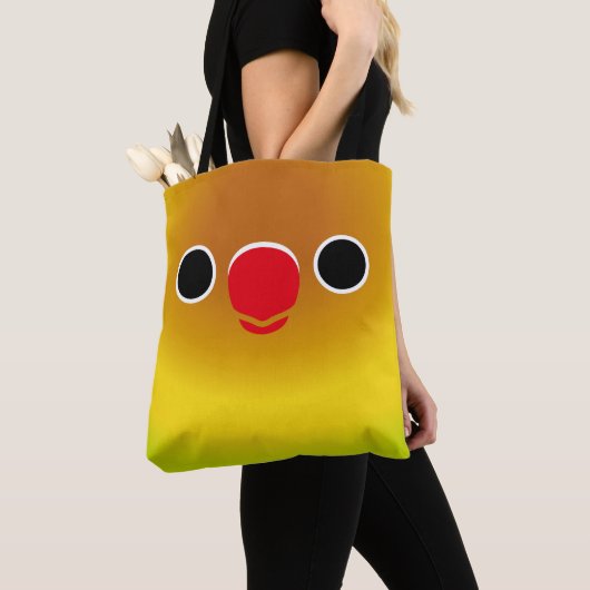 The face of a pastel green masked lovebird tote bag (Dichtbij)