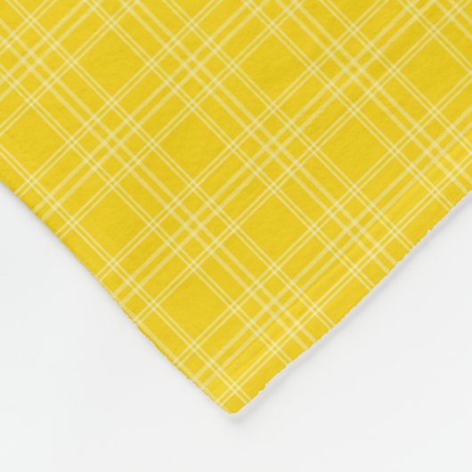 The front features a bright yellow checkered  fleece deken (Hoek)