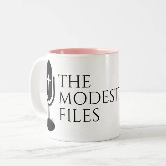 The Modesty Files - Mug Tweekleurige Koffiemok (Voorkant links)