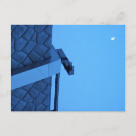 The moon hangs above the breakwater.  briefkaart