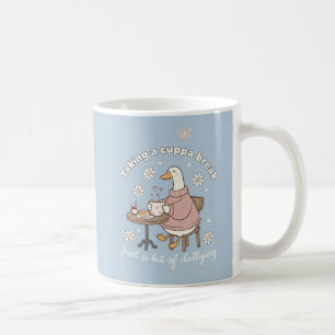 Theekop met eend die een kopje thee drinkt koffiemok