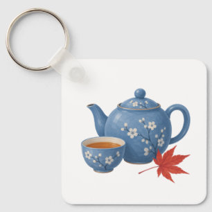 Theepot en herfst esdoornblad sleutelhanger