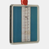 thermometer, voorzien van een frygienkap metalen ornament (Rechts)