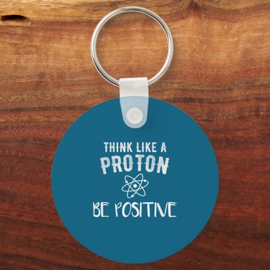 Think Like A Proton Be Sitive Funny Science Motiva Sleutelhanger (Voorkant)