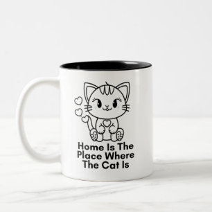 Thuis is de plaats waar de kat zich bevindt tweekleurige koffiemok