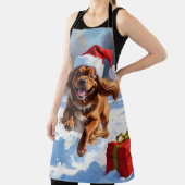 Tibetaanse Spaniel loopt in de sneeuw met kerst Pe Schort (Insitu)