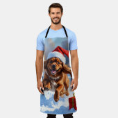 Tibetaanse Spaniel loopt in de sneeuw met kerst Pe Schort (Gedragen)