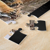 Tijgerkubussen bij het spelen legpuzzel (Zijkant)