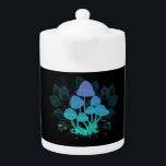 Toadvoorraad in Bushes Theepot<br><div class="desc">Mysterious, bioluminescent, hallucinogenic, bright toadstools with bushes of marsh plantages on night, dark, glowing background. Glowing mushrooms. Goblincore, Mushroomcore</div>