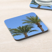 Topjes palmbomen tegen de blauwe hemel bier onderzetter (Linkerzijde)