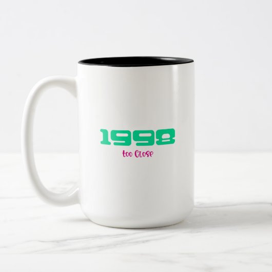 Topnummer 1998 tweekleurige koffiemok (Links)