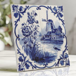 Traditionele Delfts Windmolen en Bloemen Tegeltje<br><div class="desc">Breng klassieke Nederlandse charme naar huis met deze Delfts blauwe tegel met ingewikkelde kobaltblauwe bloempatronen en windmolenscènes op helder wit keramiek. De met de hand beschilderde details, het delicate penseelwerk en de esthetiek roepen een authentiek Hollands volkskunstgevoel op. Perfect voor backsplashes, accentmuren of het toevoegen van een vleugje tijdloze elegantie...</div>