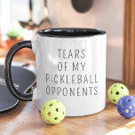 Tranen van mijn pickleball tegenstanders grappig mok<br><div class="desc">Show je competitiegeest af met deze humoristische pickleball-mok met de tekst: "Tears of My Pickleball Opponents." Perfect voor pickleball spelers die genieten van een speelse touch van sass, deze mok is een geweldig cadeau voor vrienden, teamgenoten, of iedereen die houdt van het spel. Met zijn schone, minimalistische ontwerp is het...</div>