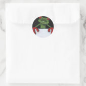 TREE FROG HOLDING SIGN: JIJ SPEELT FORMULERING AAN RONDE STICKER (Tas)