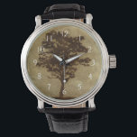 Tree Silhouette on Bronze Background Horloge<br><div class="desc">A bronze background serves as the scene for this silhouette of a tree with branches swaying in the breeze. You almost feel as if you could rest your back against this tree,  sit on the ground and take a long nap.</div>