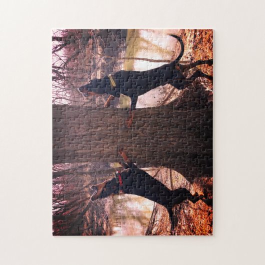 Treing Black & Tan Coonhounds op de rivier Legpuzzel (Verticaal)