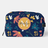 Trendy levendig bloemenpatroon op blauw monogram toilettasje (Achterkant)