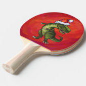TRex Dino in Santa Hat op rood Tafeltennisbatje (Voorkant Gekanteld)