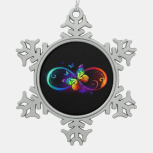 Trillende oneindigheid met regenboogvlinder op zwa tin sneeuwvlok ornament