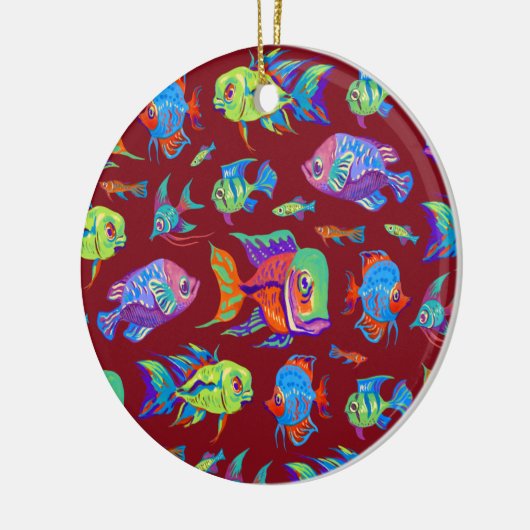 Troebele tropische vissen op donkerrood keramisch ornament (Links)