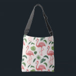 Tropical Flamingo Tote Crossbody Tas<br><div class="desc">Make summer your constant companion! Greet your day with a touch of tropical charm with this trendy shoulder bag featuring a pink flamingo and green leaf print. Designed to be your perfect companion for shopping and outings, this bag is practical, comfortable, lightweight, and durable enough to withstand everyday use. Shine...</div>