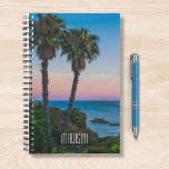 Tropisch eiland Paradise Sunset Persoonlijke naam Planner<br><div class="desc">Dit ontwerp is voorzien van een tropisch eiland met palmbomen en een rustig zee met de ondergaande zon en een bewerkbare gepersonaliseerde naam geschreven in de hedendaagse typografie. Personaliseer door de tekst in het tekstvak te bewerken of te verwijderen voor geen tekst. #tropical #sunset #beach #ocean #personalized #planner #gift</div>