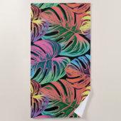 Tropisch kleurrijk monsterblad op zwart strandlaken (Voorkant)