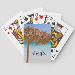Tropisch strand met rieten parasol pokerkaarten