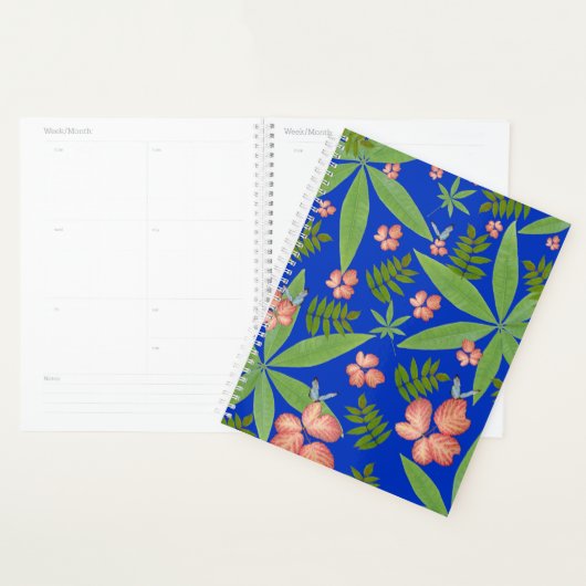 Tropische bladeren op blauw planner (Display)