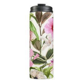 Tropische felgroene bladeren, bloemen. thermosbeker