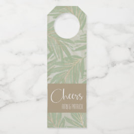 Tropische groene en gouden bladeren op pagina's flessenhanger