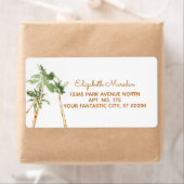 Tropische koperen palmbomen die het strand versche etiket (Insitu)