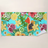 Tropische mix-fruit, bloemen en bladeren op blauw strandlaken (Voorkant)