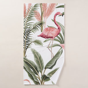 Tropische roze flamingo, bananenbomen en badhanddoek