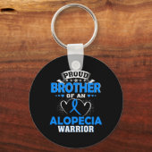 TROTSE BROER VAN EEN ALOPECIA KRIJGER SLEUTELHANGER (Achterkant)