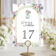 Trouwboog met wilde bloemen in metselpotten