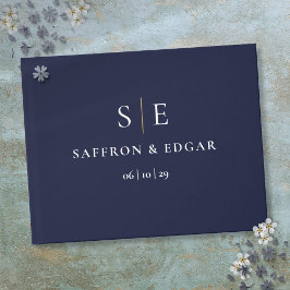 Trouwfeest in marineblauw en goud met monogram gastenboek