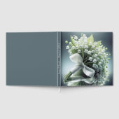 Trouwlelie van de vallei boeket op een spiegel gastenboek (Volledig)