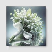 Trouwlelie van de vallei boeket op een spiegel gastenboek (Voorkant)