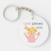 Tuin met de quote 'Liefde groeit hier' Sleutelhanger (Voorkant)