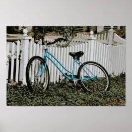 Turquoise Bicycle Leaning on a White Picket Fence Poster