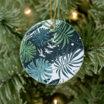 Turquoise Blauwgroen Tropische Kerstmis Keramisch Ornament<br><div class="desc">Tropische botanische verf en bladeren in blauw, blauwgroen en groen op de voorzijde van deze kerstversieringen en uw groet en namen op de achterzijde in het teken op een blauwe achtergrond - VERANDEREN het gezegde, veranderen de doopvonten, de doopvontkleuren en de kleur van het lijst. OBJECTEN AANPASSEN in onze winkel....</div>
